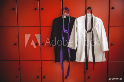 Picture of Two karate uniforms hanging on locker